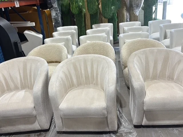 Rows of upholstered chairs staged for cleaning